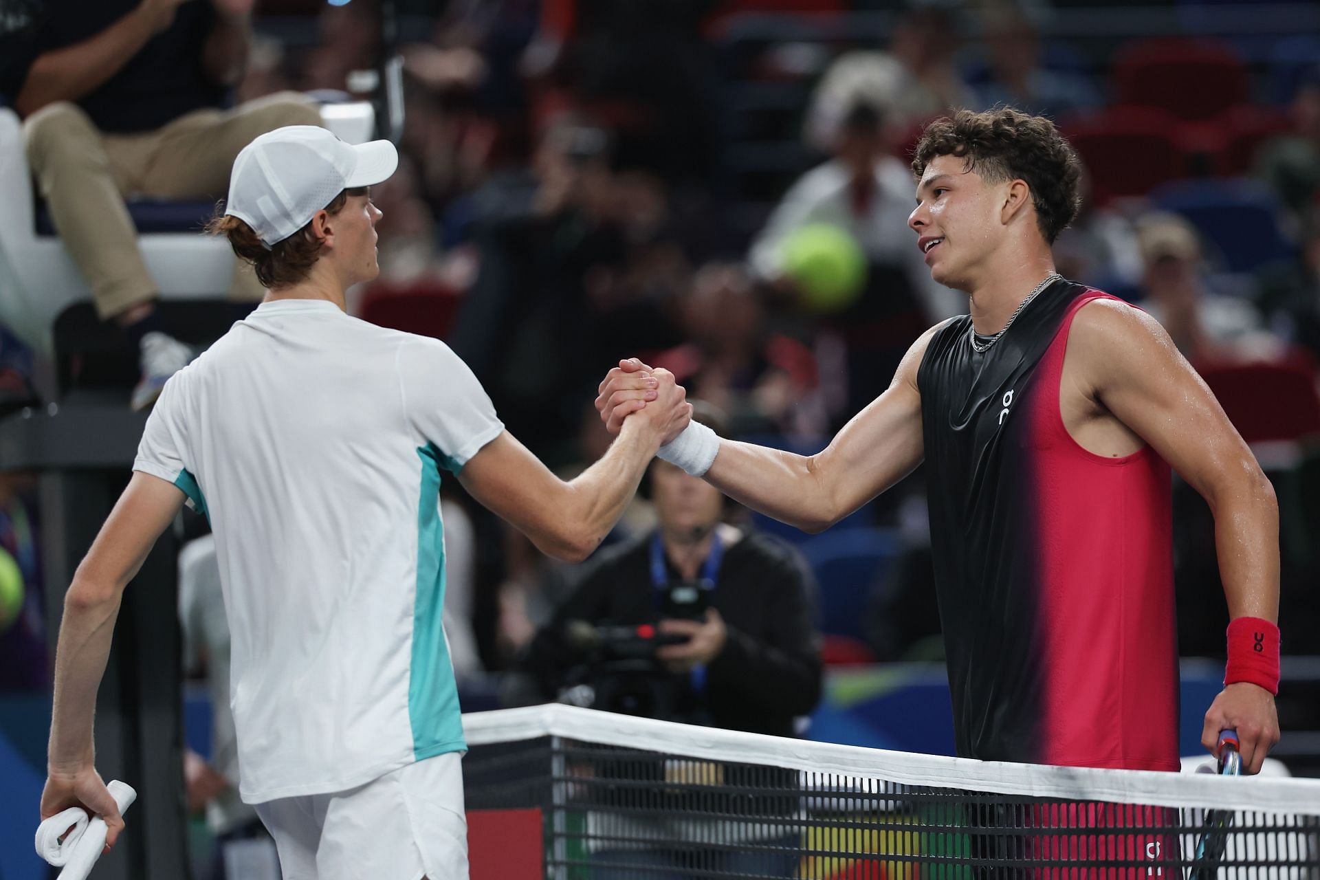 Jannik Sinner and Ben Shelton greet each at Shanghai last year